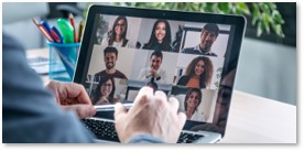 Laptop screen showing team meeting