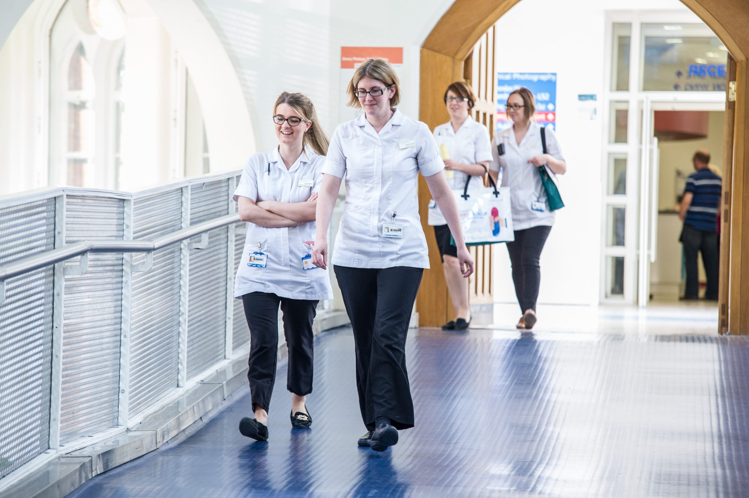 Student Nurses walking down a corridor